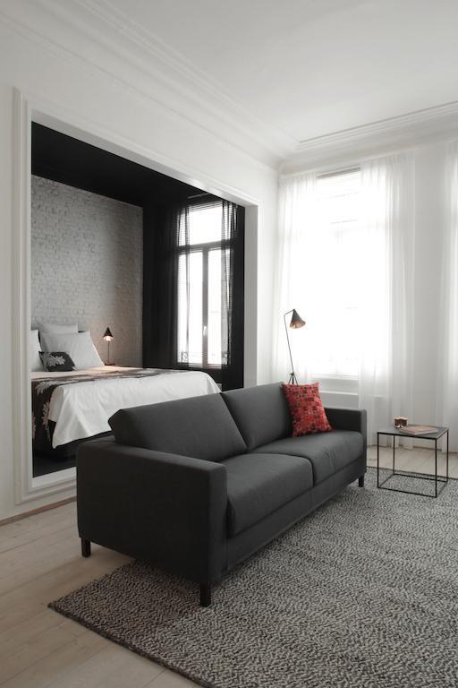 Maison Nationale City Flats & Suites แอนต์เวิร์ป ห้อง รูปภาพ A room at the hotel